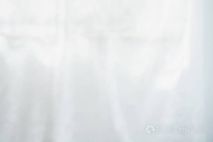 白色布表面的模糊照片被皱成不同的纸样.适用于制作豪华壁纸.