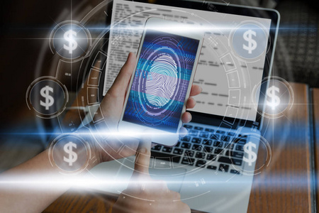 手按指纹扫描智能手机与技术图标，以解锁屏幕上的货币美元图标和数字屏幕业务和技术概念Fintech和ai概念