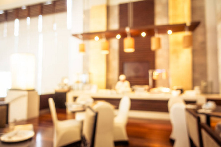 抽象模糊和分散焦点自助早餐在酒店餐厅内部，背景老式过滤器。