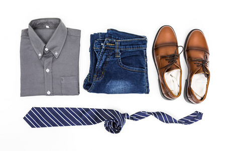 s apparel, shirt, jean, brown shoes and necktie on white backgro