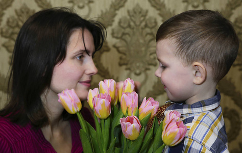 s day and gives her a bouquet of beautiful tulips