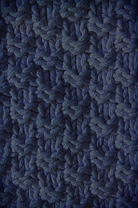 针织羊毛织物的质地为蓝色。网站或移动设备的背景