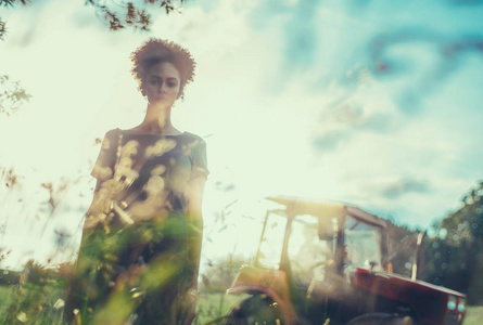  AfricanAmerican girl outdoors with field engine in the backgro