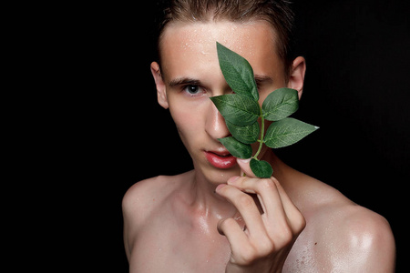 s skin care. Ripped muscular handsome man on black background