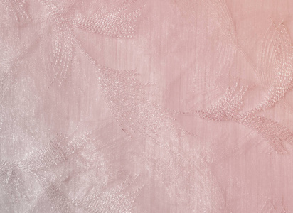 纹理背景图案。 粉彩色调的薄纱。 粉红色织物的抽象背景。 柔软质地的织物粉红色糊状色调。 破旧别致的风格。 皱巴巴的薄纱作为背景