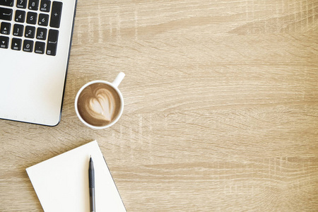  white laptop computer keyboard, cup of coffee with heart shape 