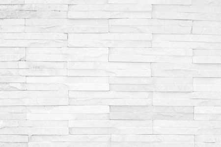 灰色和白色砖墙纹理背景。 砖或石材地板内部岩石旧图案清洁混凝土网格不均匀砖设计堆叠。