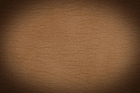 浅棕色皮革纹理表面。 接近天然谷物牛皮浅棕色皮革纹理表面。 背景