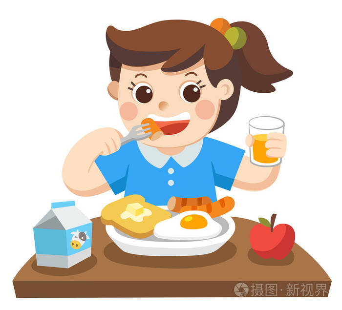 一个小女孩早上很高兴吃早餐