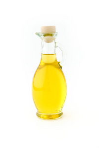 额外的原始橄榄油在一个美丽的玻璃瓶在白色背景。