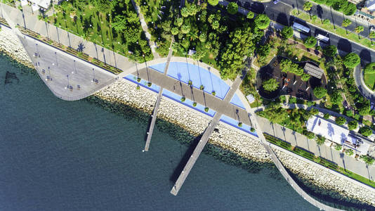 s eye view of the jetties, beachfront walk path, palm trees, Med