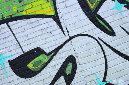 涂鸦图纸的碎片。 在街道艺术文化的风格中，用油漆污渍装饰的旧墙。 绿色色调的彩色背景纹理。