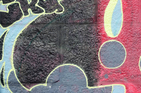 涂鸦图纸的碎片。 在街道艺术文化的风格中，用油漆污渍装饰的旧墙。 多色背景纹理。