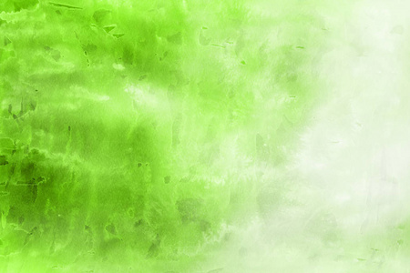 绿色水彩颜料在纸上抽象背景