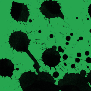 绿色背景上的抽象黑色油漆飞溅纹理