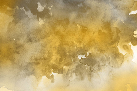 金色水彩颜料纸抽象背景