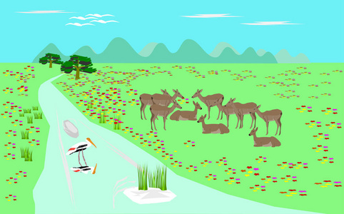 成群的羚羊在绿色的牧场溪流上。 背景上有一座山。