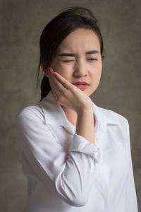  sick asian woman suffering from toothache, tooth decay, tooth s