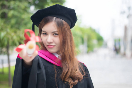  portrait of college successful smiling woman student with gradu