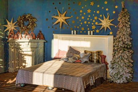 s interior. Bedroom with fireplace decorated with Christmas star