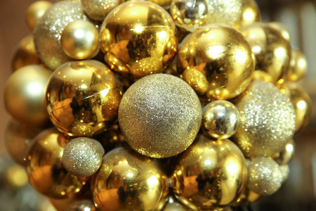 s round golden balls. Christmas balls close up picture. Three go