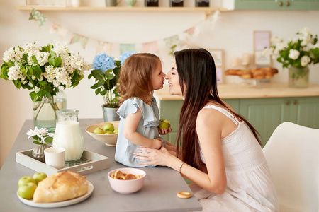 s day greeting card. Family mother and baby daughter in morning 