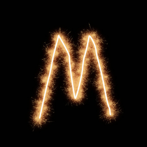 字母m的字母斯奎布斯帕克斯在黑色背景上写的。