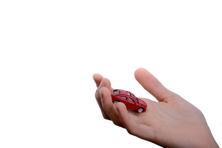 s hand holding a red car on a white background