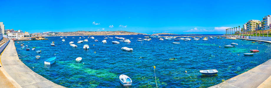 s Bay marina with moored small fishing boats, and leisure boats 