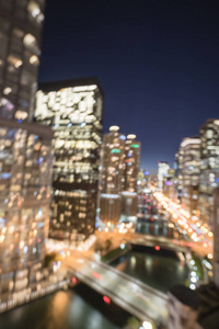 抽象模糊离焦的芝加哥滨江写字楼及住宅楼高层..从明亮的天际线俯瞰城市夜景