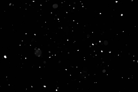 暴风雪的质地。 黑色背景下的灯光，天空中飞舞的雪花