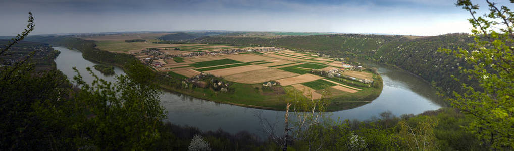 s eye view. Panoramic photo of a beautiful village and fields on