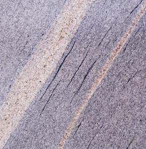 灰色大理石背景，有斑点和线条。 地质学