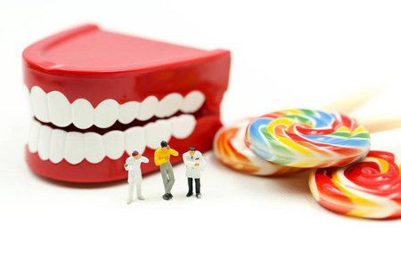 s teeth with patient and sweet lollipops,healthcare medical conc