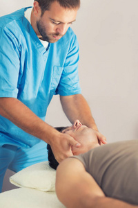 s neck, Therapist wearing blue uniform, Osteopath,  Chiropractic