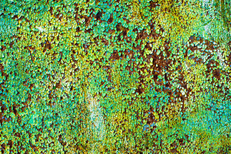 抽象的背景的老铁与裂开的油漆的绿色, 蓝色和棕色