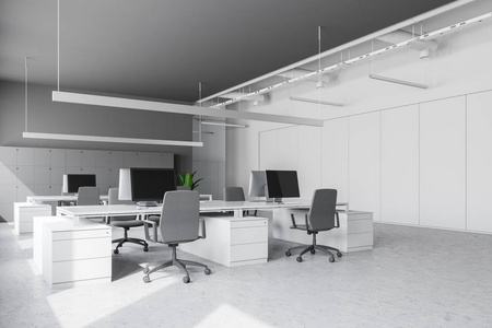 现代办公场所有白色和灰色的墙壁，石头地板，一排排白色的电脑桌，靠近墙壁的椅子和储物柜。3D渲染