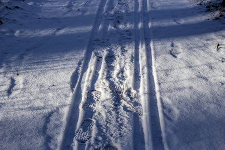 s sledges and feet in the snow