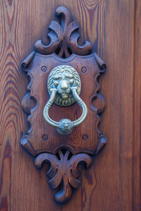 s head on a wooden door in the Spanish city of Palma de Mallorca