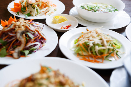  fresh vegetable salads on table in cafe.Delicious Chinese dishe