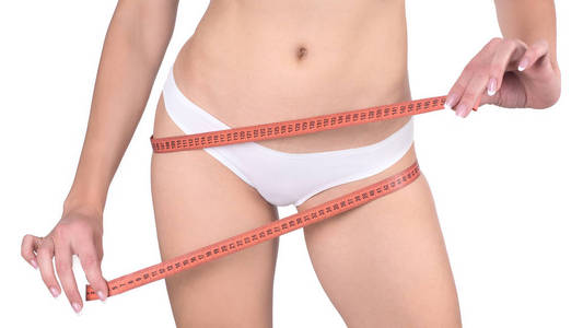 纤细适合女性臀部与测量带, 查出在白色