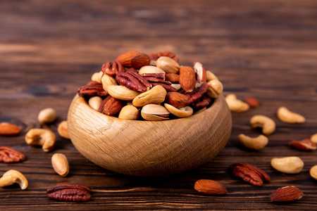  brazil edible nuts with walnut hazelnut on wood textured surfac