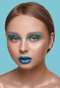 s face with perfect art make up with glitter, beauty, cosmetics 