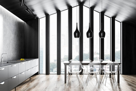 阁楼厨房内部有深色木制和灰色墙壁，木制地板，灰色台面，内置水槽和木制餐桌，有透明的椅子。 3D渲染