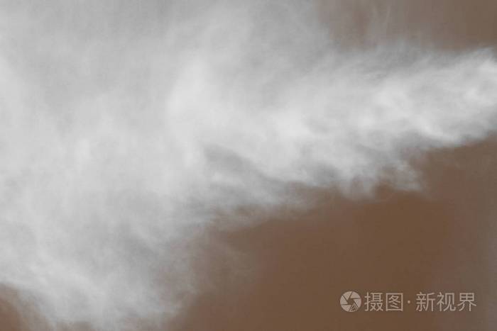 漂亮的橙色水雾在空气中特写纹理抽象的照片背景
