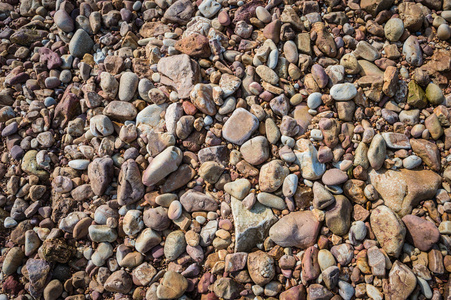海滩上砾石或卵石的图案背景