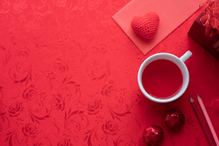 s day holiday celebration with hearts and cup of juice on red ba