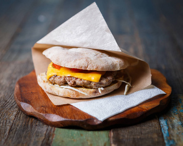  vegetables in sauce served in crusty bun in decorative brown pa