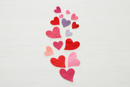 s day concept. Paper hearts over wooden white background. Flat l