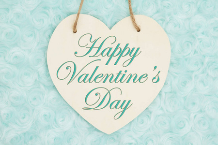 s Day message on wood heart shaped plaque with pale teal rose pl